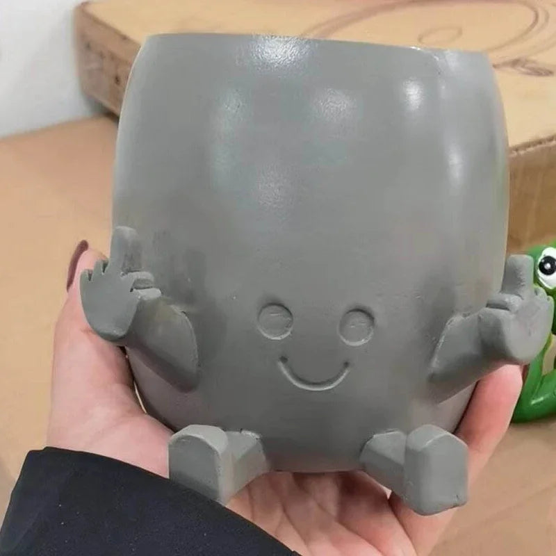 Zabawna doniczka figurka