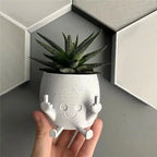 Zabawna doniczka figurka