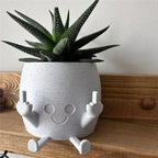 Zabawna doniczka figurka