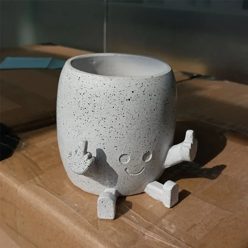 Zabawna doniczka figurka